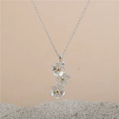 triangle forget me not necklace